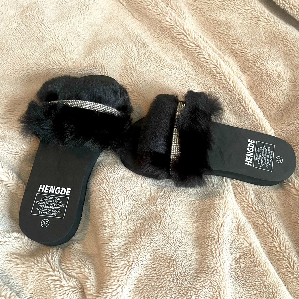 Black furry slippers